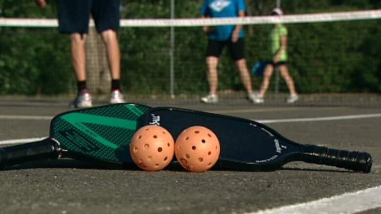 Pickleball rackets and balls. 