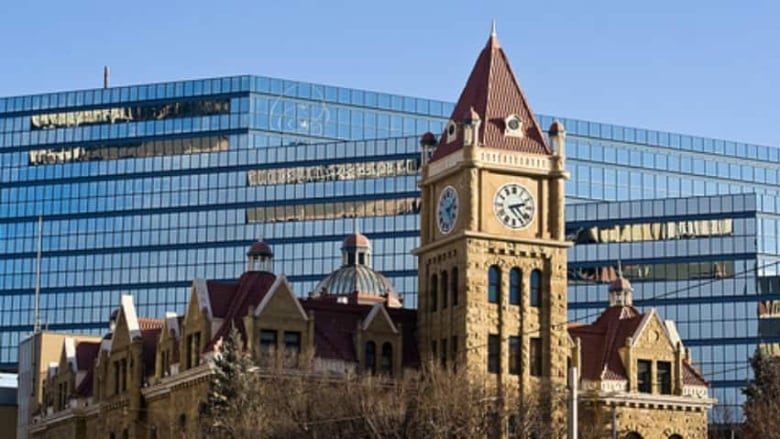 Calgary's old city hall is seen in the foreground, with new city hall in the background.