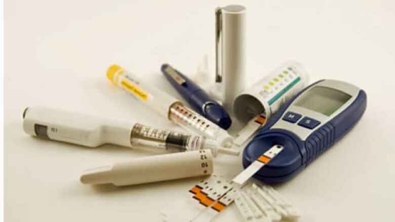 Equipment commonly used by people with diabetes, including an insulin pen for injections and a glucose meter.