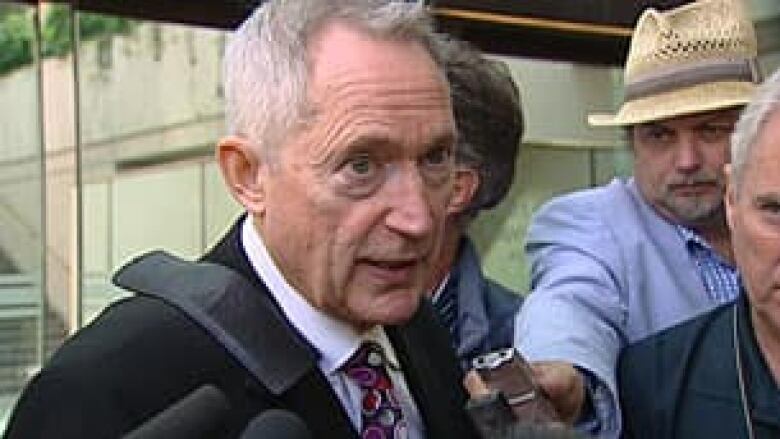 Lawyer Michael Bolton speaks with reporters on the steps of B.C. Supreme Court in Vancouver.