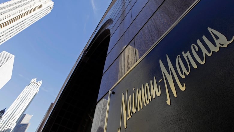 The logo for luxury retailer Neiman Marcus is shown on the side of a building.