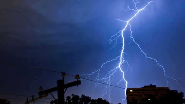 Lightning striking near power lines