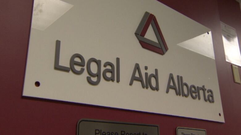 A sign reads 'Legal Aid Alberta'