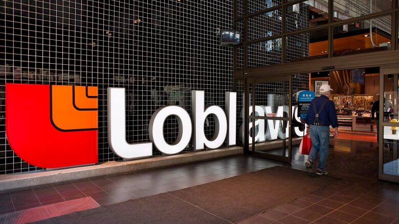 A large Loblaw sign is displayed at a store in Toronto.