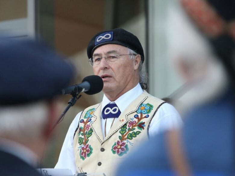 Clement Chartier addresses a crowd.