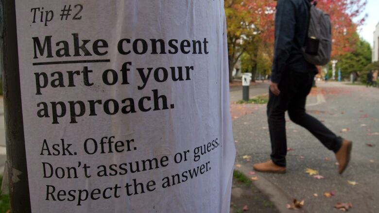 White paper taped on tree stump