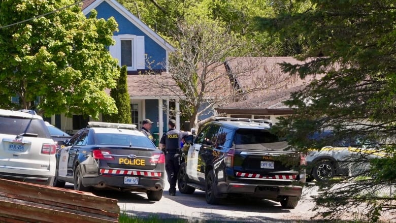 The door of a black and white OPP police cruiser is pictured.