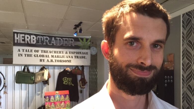 A man is shown with a sign behind him that says 'Herbtrader.'