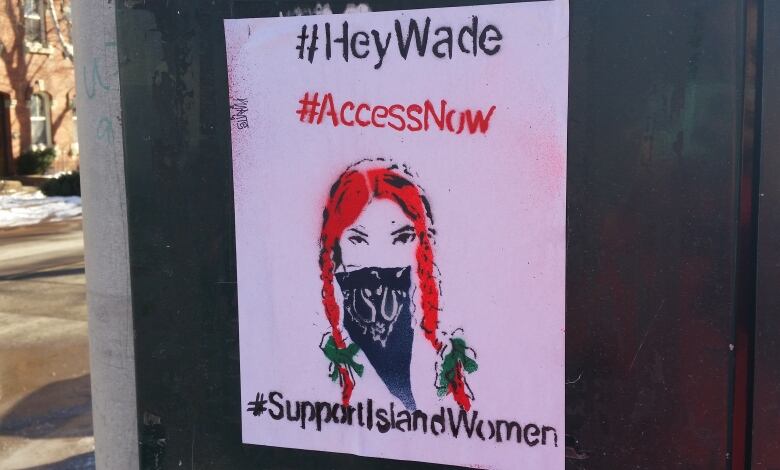 A pro-choice poster featuring an illustration of a woman's face who looks like Anne of Green Gables. The sign says #HeyWade #AccessNow #SupportIslandWomen