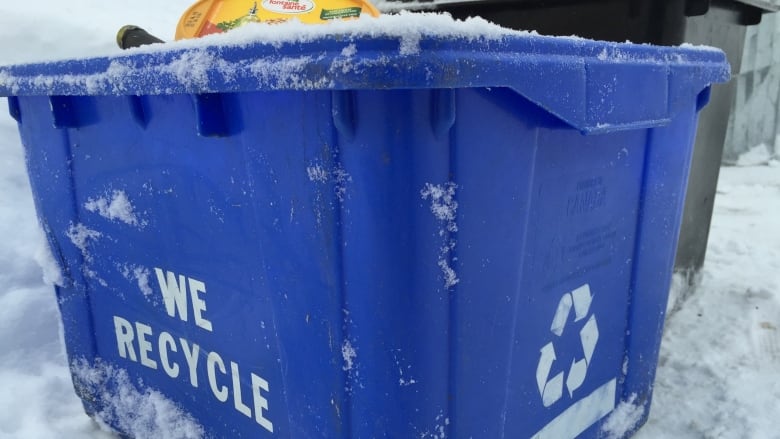 A recycling blue box.