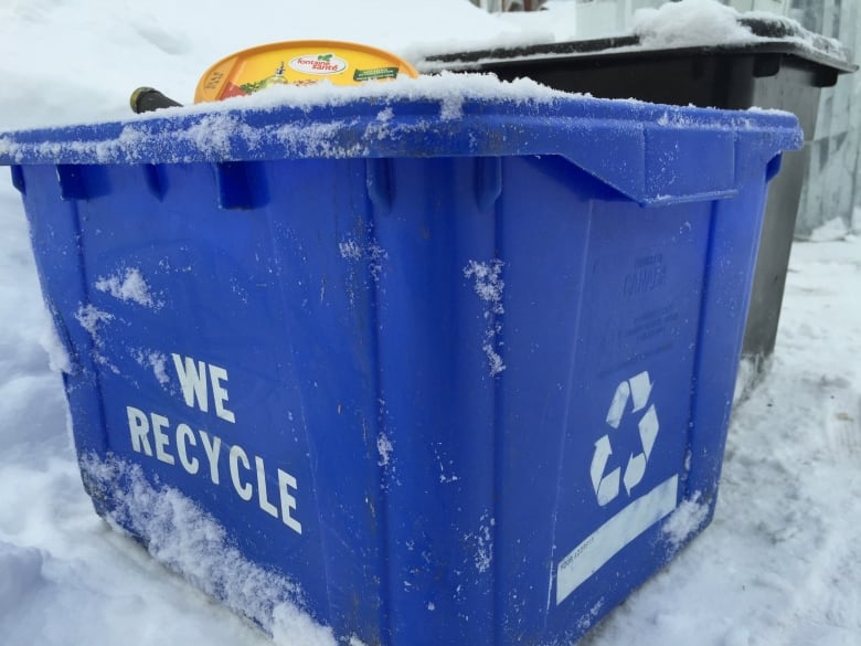 A recycling blue box.