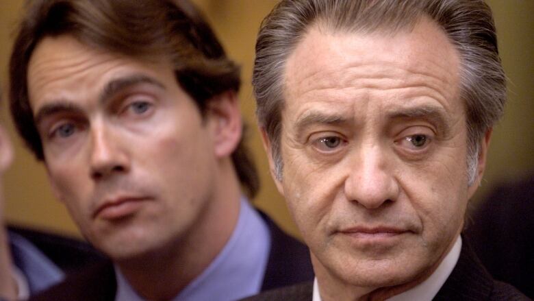 Postmedia boss Paul Godrey in 1998 when he was president of Sun Media with then Quebecor Inc. Vice-President Pierre Karl Peladeau (L) during one a series of mergers and takeovers that resulted in a consolidation in Canada`s newpaper sector.