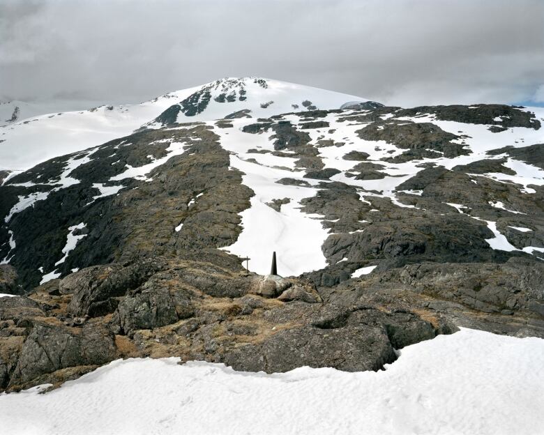 A small monument, numbered 120, marks the border in Chilkoot Pass in Alaska.