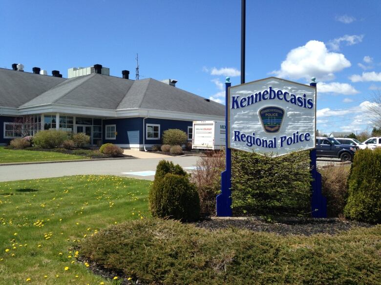 Sign in the foreground, building in the back. 