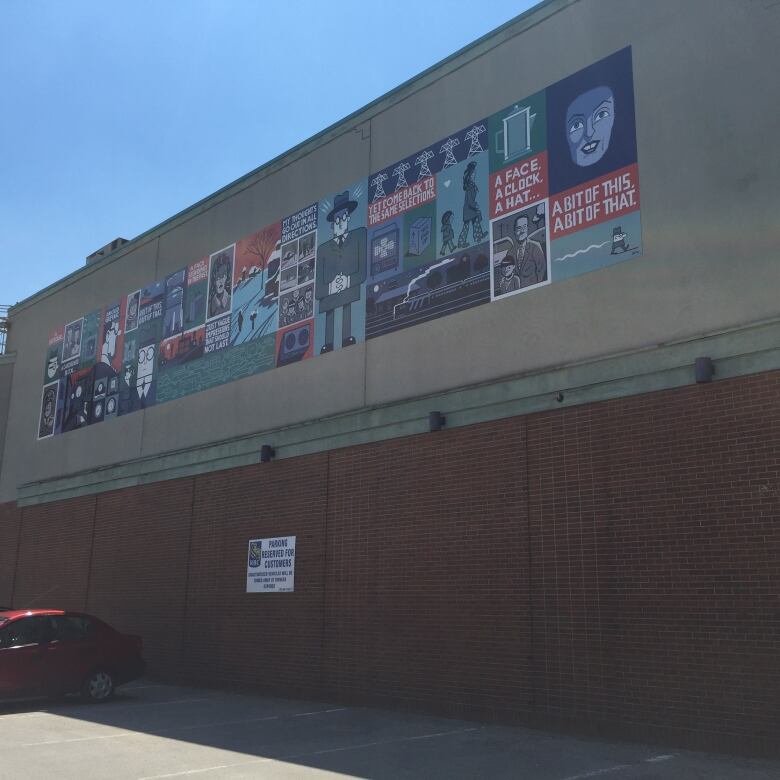 Cartoon strip mural on the side of a building