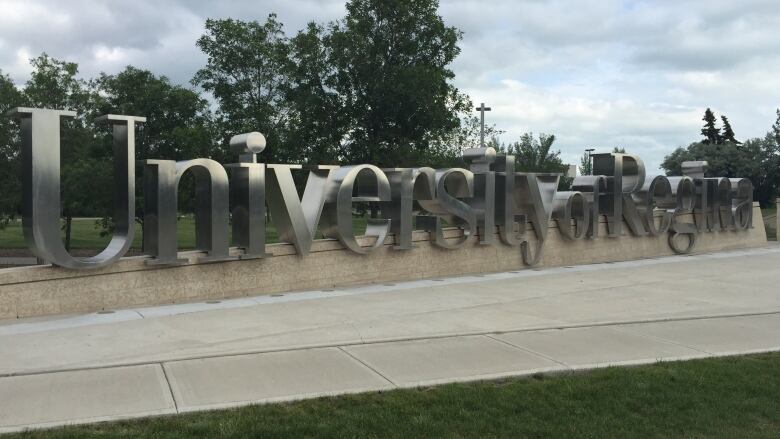 A large sign with the words University of Regina. 