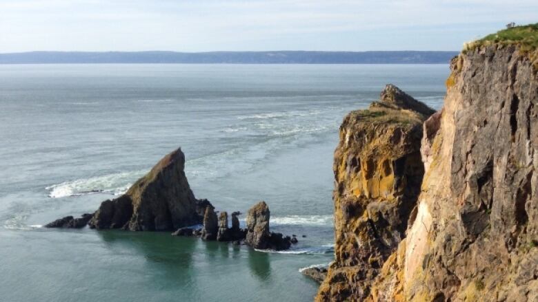 A rocky cape jutting out into the ocean.