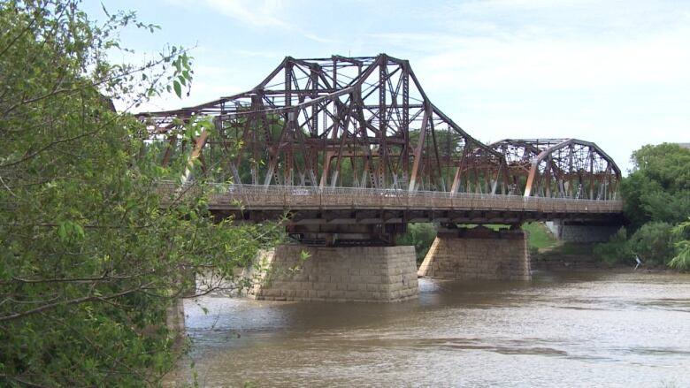 An old steel-truss bridge.