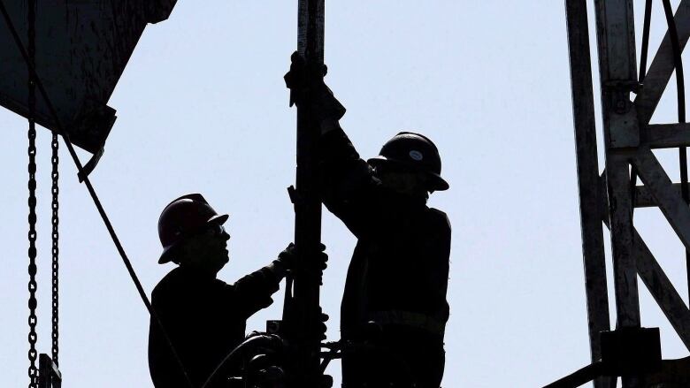 Thousands of people work in the oil and gas sector, including these oil rig workers.