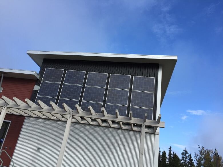 Solar panels on the second storey of a building.