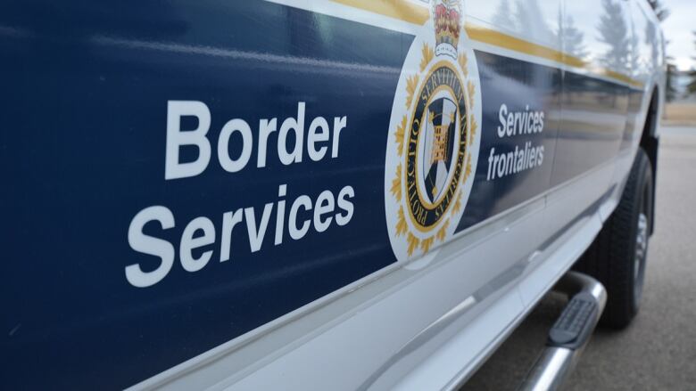 The Canada Border Services Agency is on a vehicle.