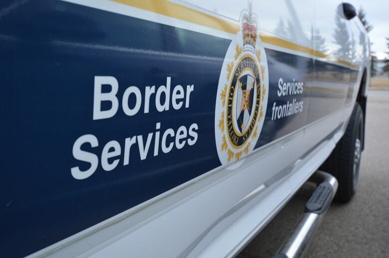 The Canada Border Services Agency is on a vehicle.