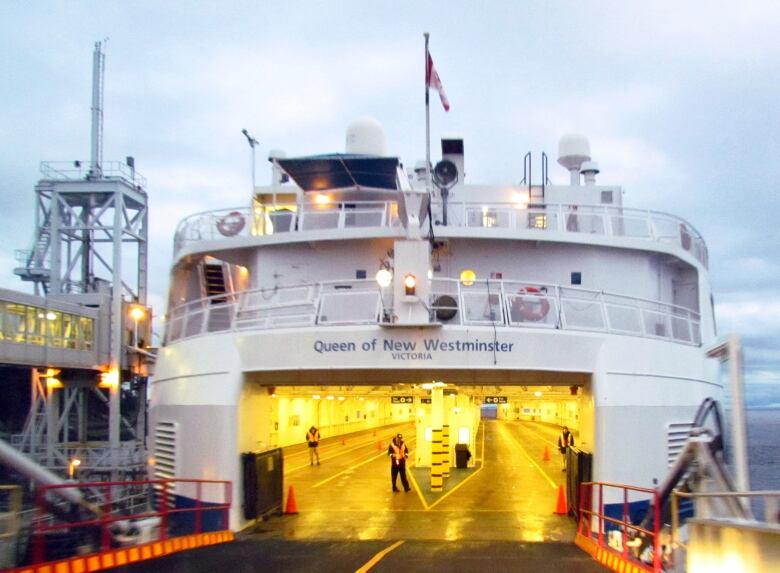 A B.C. Ferries vessel docked with its car decks visible.