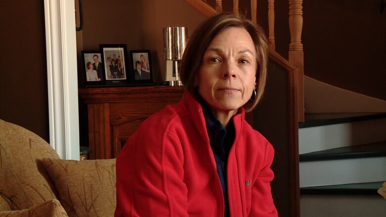 Woman wearing a red jacket.