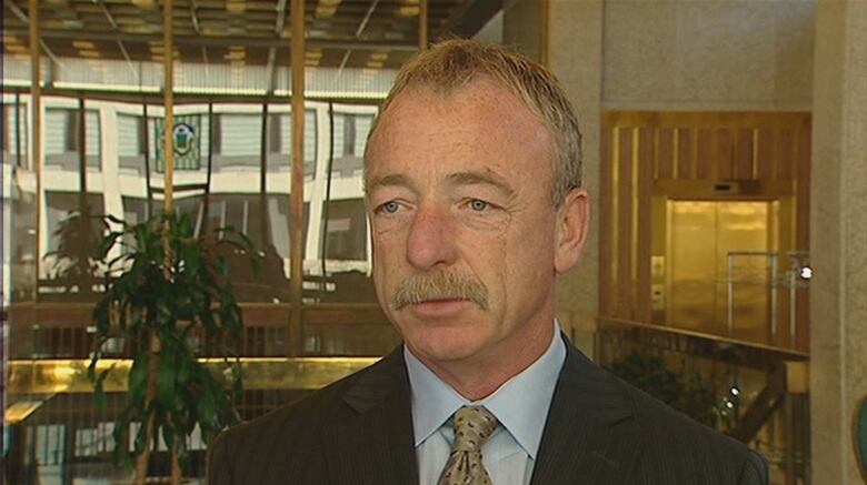  A head-and-shoulders image of a man standing in city hall.