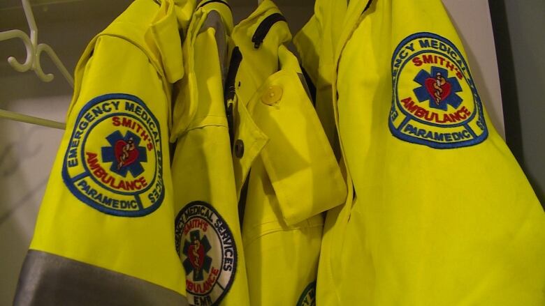 Paramedic's high visability jackets hanging up at the ambulance base.