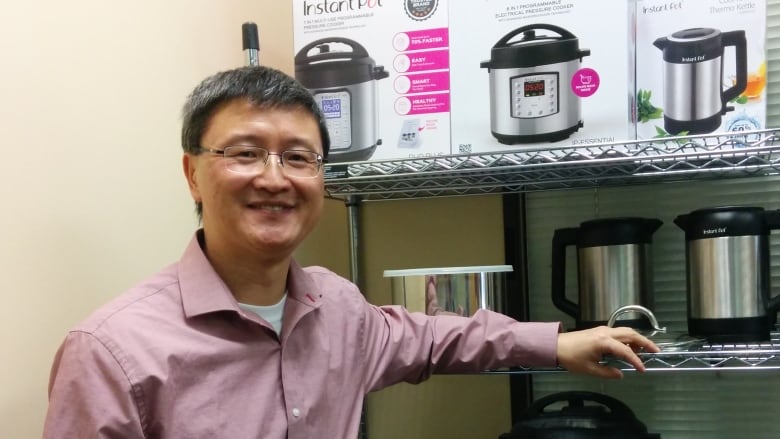 Instant Pot inventor Robert Wang is shown with the device he created.