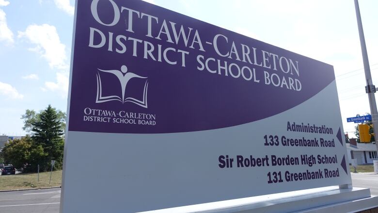 A school board sign in front of its headquarters. 