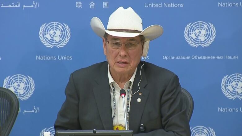 A man speaks at a press conference.