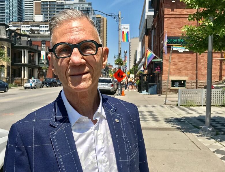 A picture of Ron Rosenes standing on the sidewalk in Toronto's