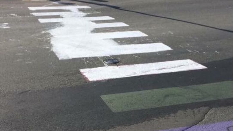 A defaced crosswalk in Woodstock