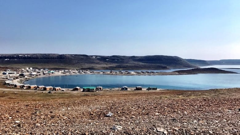 A small Arctic community rings a bay.