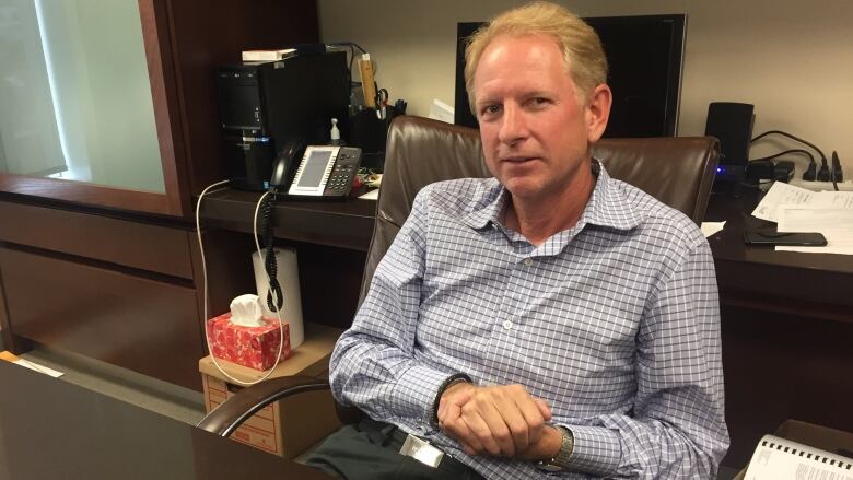 A man sitting in an office.