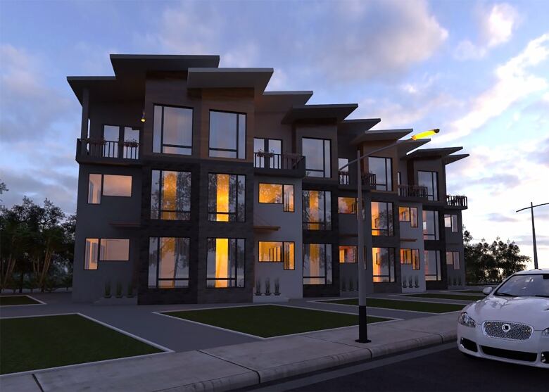 A newly built three-storey row housing with long windows lines a tidy Edmonton street. 