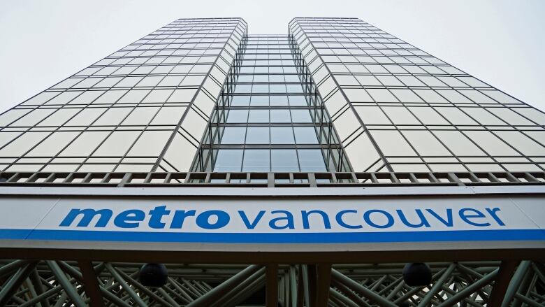 A sign outside an office building says metro vancouver.