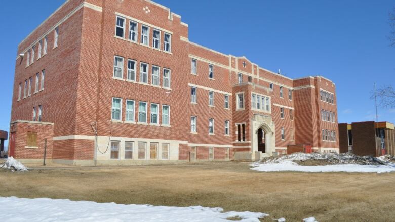 A large red brick building. 