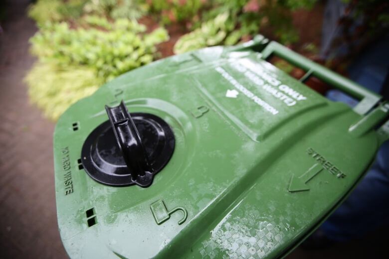 Close up of a green bin lid. 