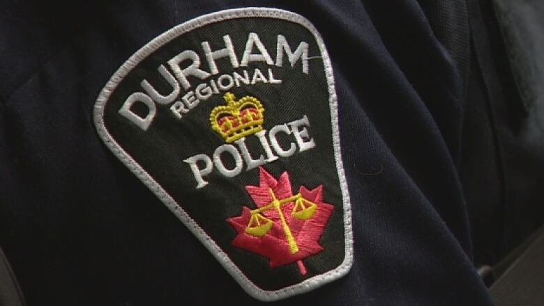 A Durham regional Police uniform badge.