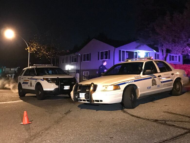 RCMP cruisers block off the scene of the shooting.