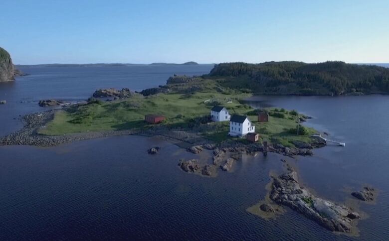 An aerial image of buildings on a green peninsula.