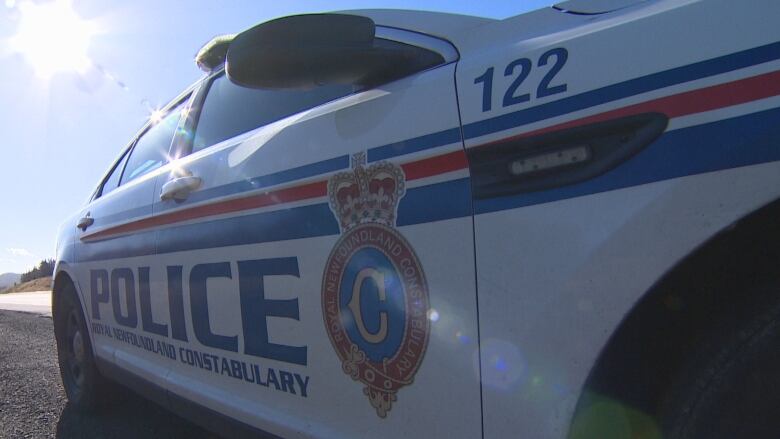 A police vehicle parked on a road.