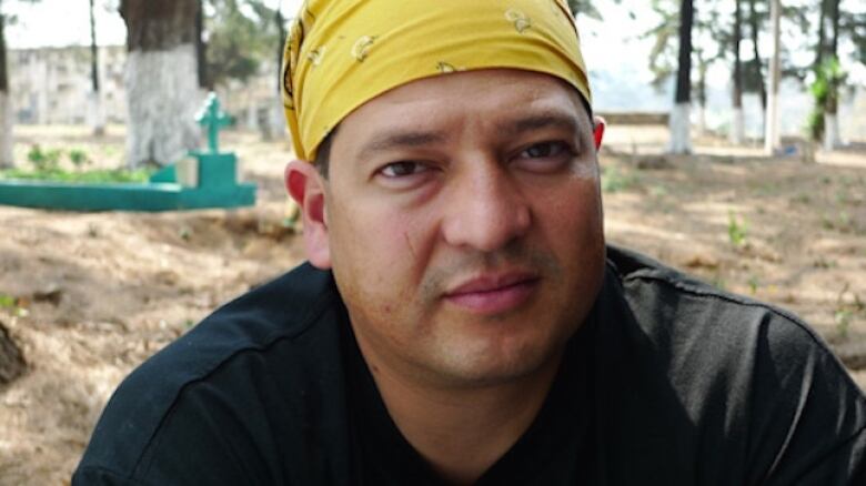 Fredy Peccerelli, director of the Forensic Anthropology Foundation of Guatemala posing for a picture in a cemetary