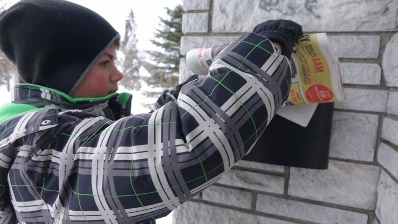 Boy delivering a paper