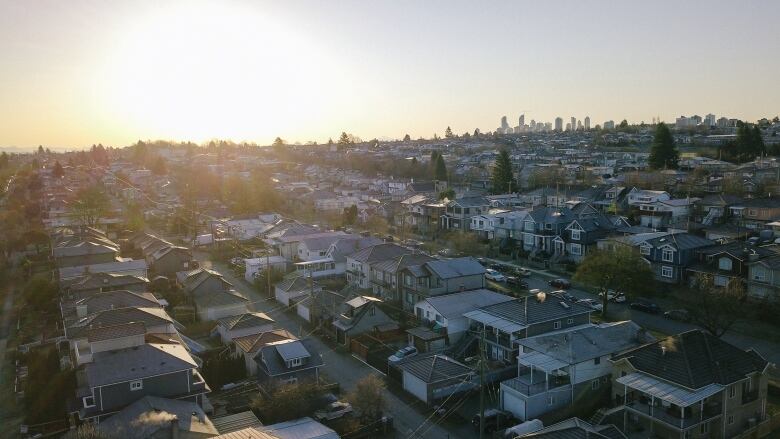 Rows of single-family homes in East Vancouver, with downtown Vancouver in the top right of the image.