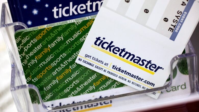 Ticketmaster tickets and gift cards are shown displayed on a box office counter.