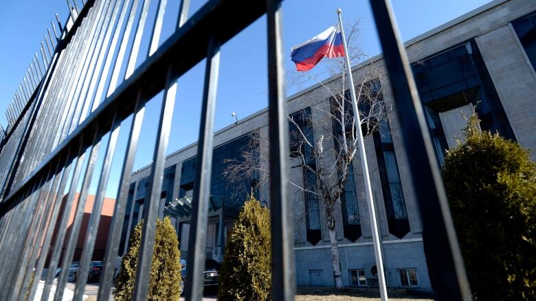 The flag flies outside the Embassy of the Russian Federation to Canada in Ottawa on Monday, March 26, 2018.